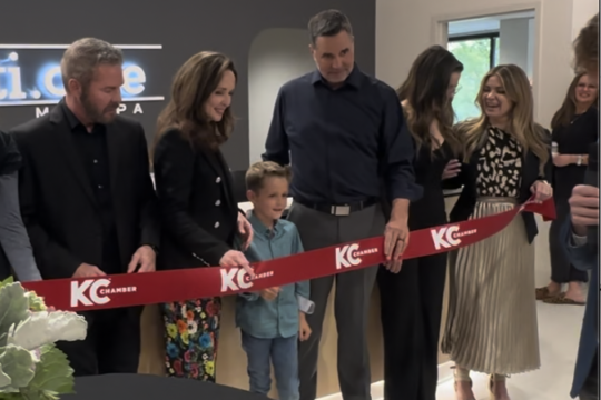 Team cutting the ribbon at their new medspa, AesthetiCare